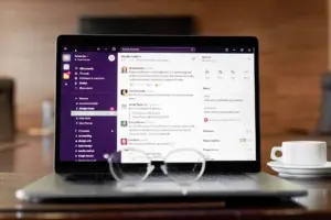A laptop on a desk with an email inbox open